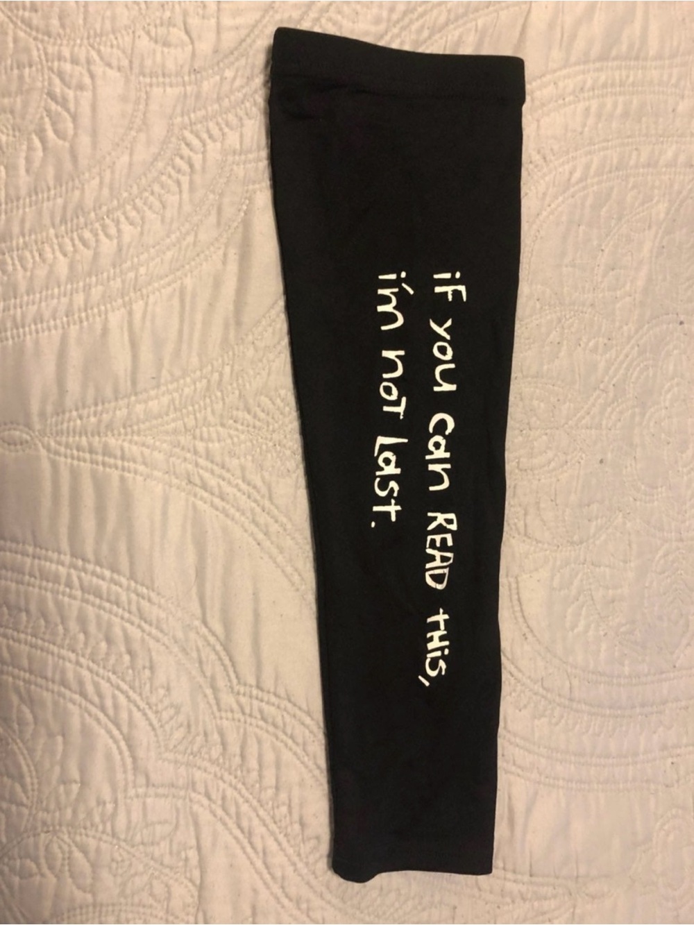 Black runners compression sleeve with ‘if you can read this, I am not last’ Funn